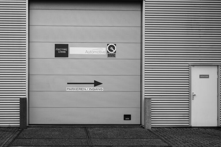 A black and white photo of a garage door A black and white photo of a garage door