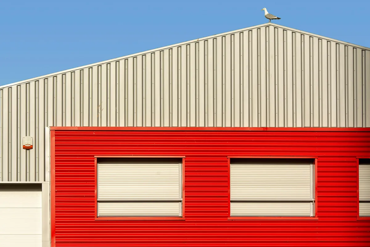 Red facade showing batch color consistency of coated panels