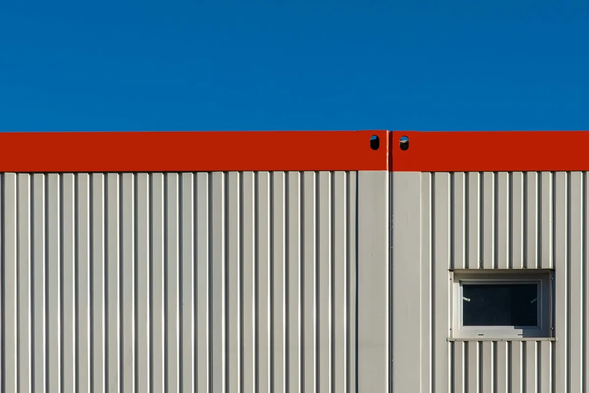 Industrial facade with large aluminium panels and panel joints