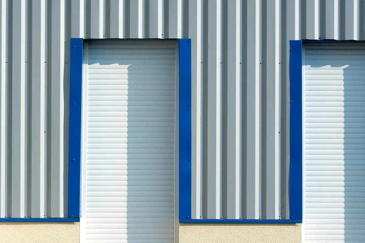 Close-up of composite panel facade showing flat panel surface