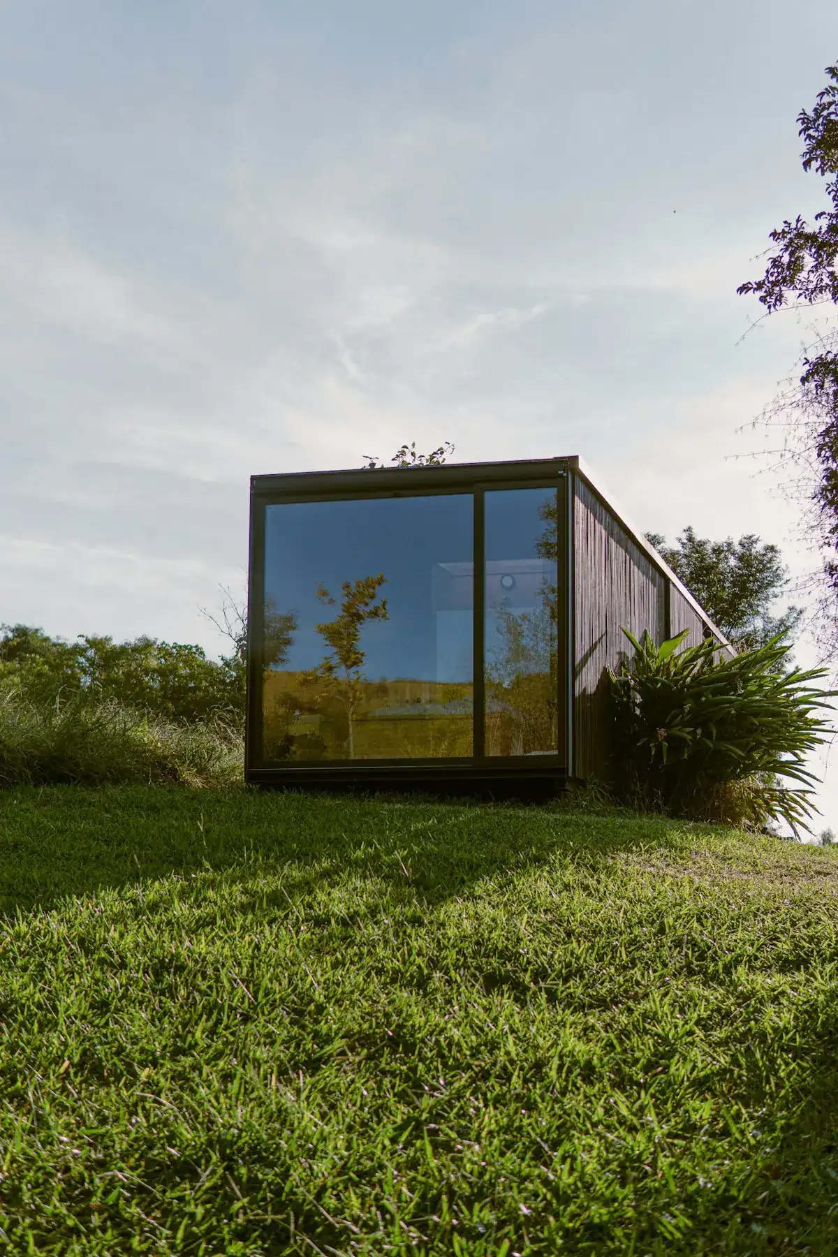 Modular container architectural structure clad in durable exterior aluminum composite panels