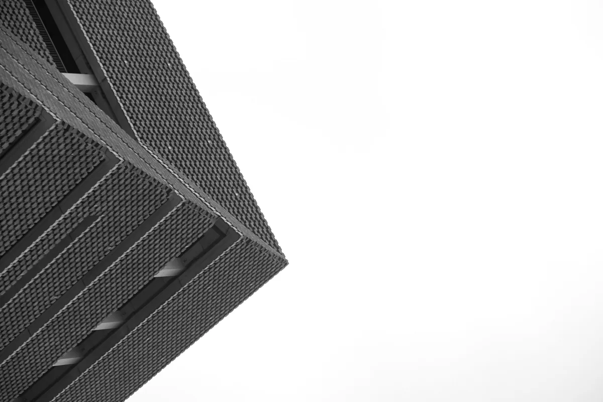 Hyper-realistic close-up product photography of a perfectly bonded RV composite panel cross-section, showing no signs of delamination, with a subtle background suggesting a quality control laboratory or testing environment, emphasizing structural integrity, clean composition, no text, no brand logos.