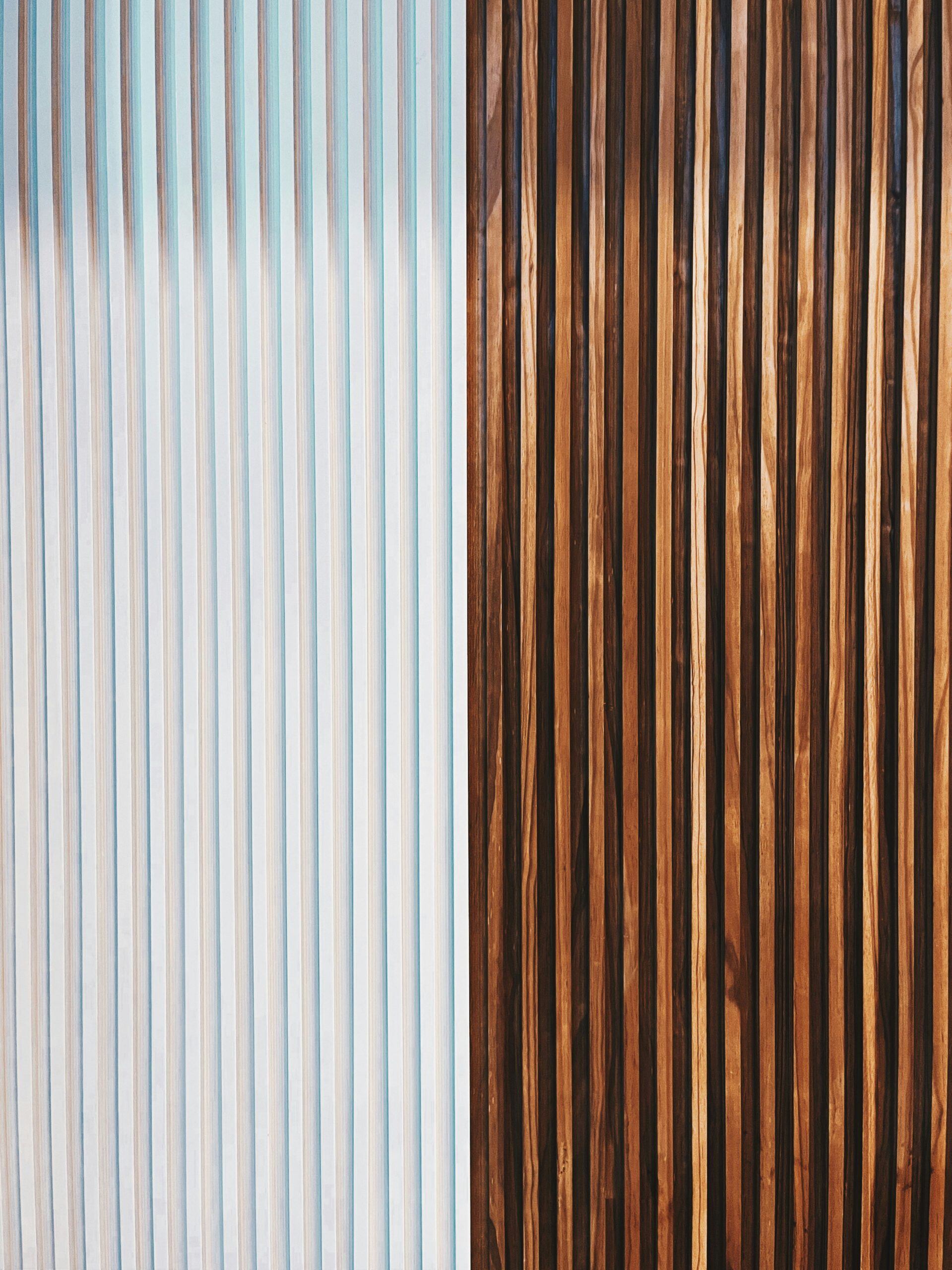 Hyper-realistic comparison photography of three distinct panel samples: a CFRT PU panel, an FRP panel, and an aluminum panel, arranged side-by-side on a clean white surface. Each panel should be clearly identifiable by its material characteristics. Bright, even studio lighting, clean composition, no text, no brand logo.