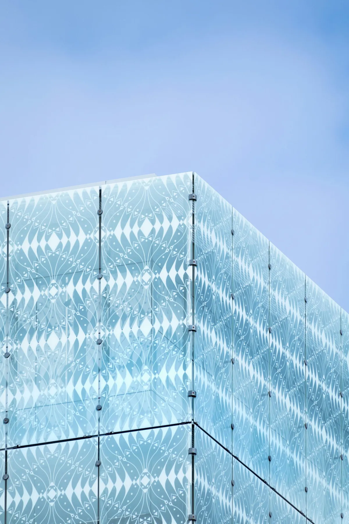 Hyper-realistic macro photography of a cross-section of a glass fiber sheet, showing individual E-glass and S-glass fibers interwoven with resin, highlighting the density and structural integrity, laboratory lighting, clean composition, no text, no brand logo