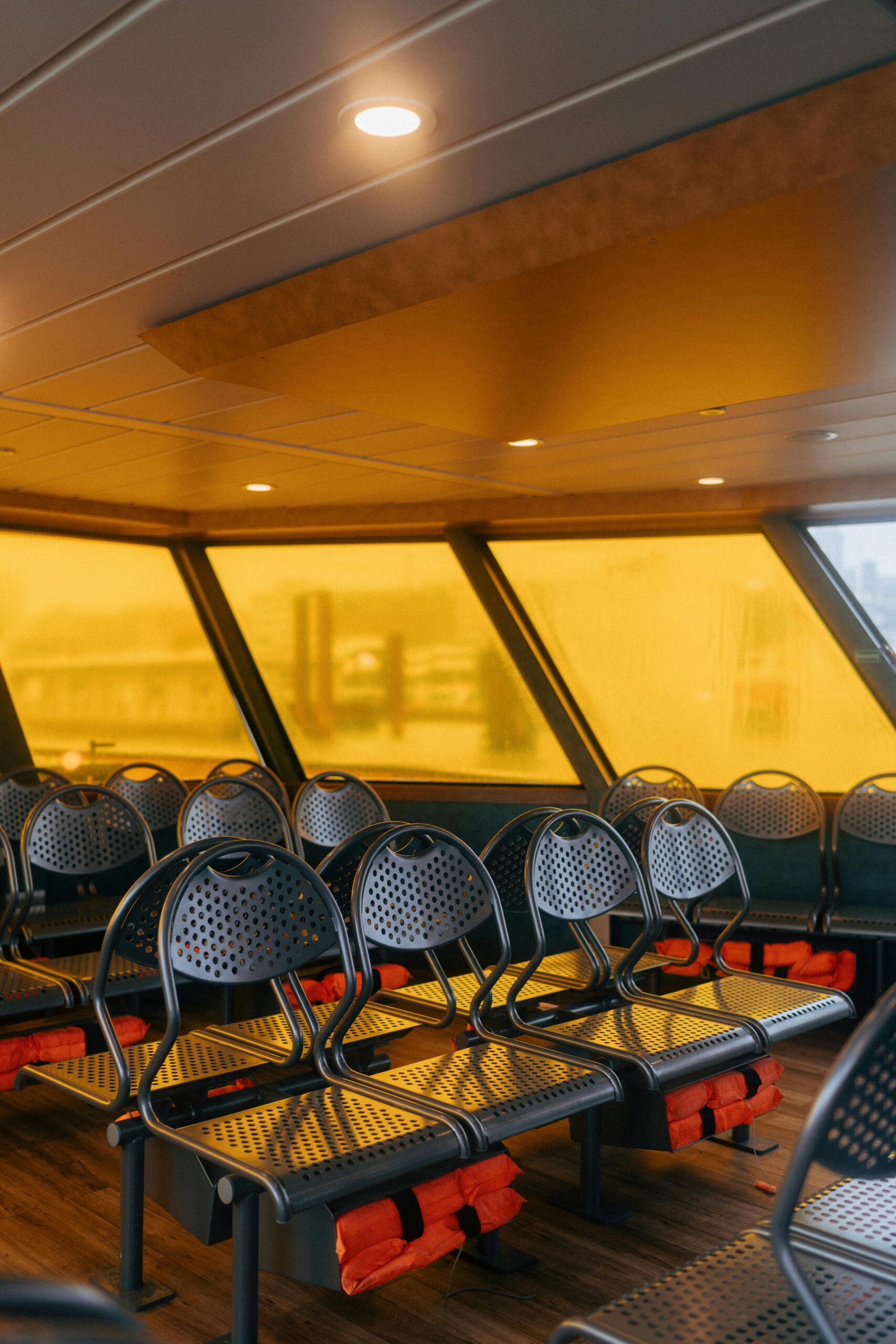 Hyper-realistic photography of marine HDPE sandwich panels integrated into various boat components: a bulkhead, a transom, and a cabin divider. The panels are shown as finished parts within a partially constructed boat interior. Natural daylight filtering into a boatyard, clean composition, no text, no brand logos.