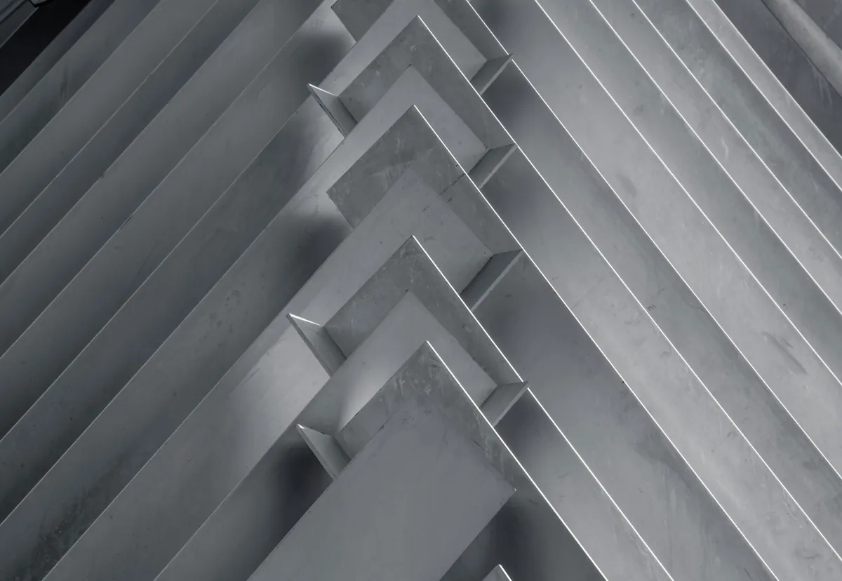 Hyper-realistic photography showcasing cross-sections of three distinct sandwich panels: one with a CFRT core, one with a GRP/FRP honeycomb core, and one with a foam core. Each cross-section is meticulously cut and displayed side-by-side on a dark, reflective surface, highlighting their internal structures and different material compositions. Sharp focus on the core materials, with soft, directional lighting emphasizing texture. Clean composition, no text, no brand logos. Illustrate the diverse offerings of aluminum sandwich suppliers.