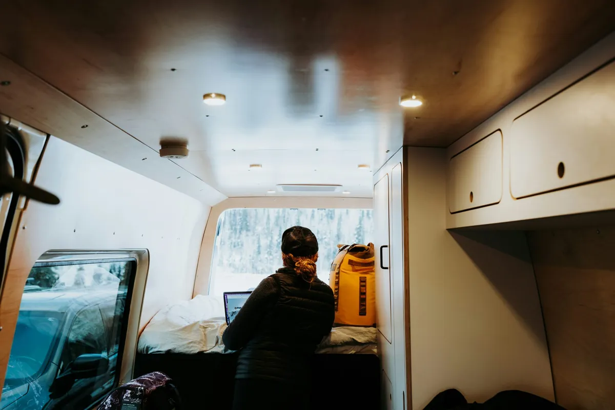 Hyper-realistic photography showcasing fire-resistant composite panels integrated into various vehicle applications, such as an RV wall, a refrigerated truck body interior, or a marine vessel bulkhead. The panels are seamlessly installed, emphasizing their practical use and fire safety. Clean composition, no text, no brand logos.