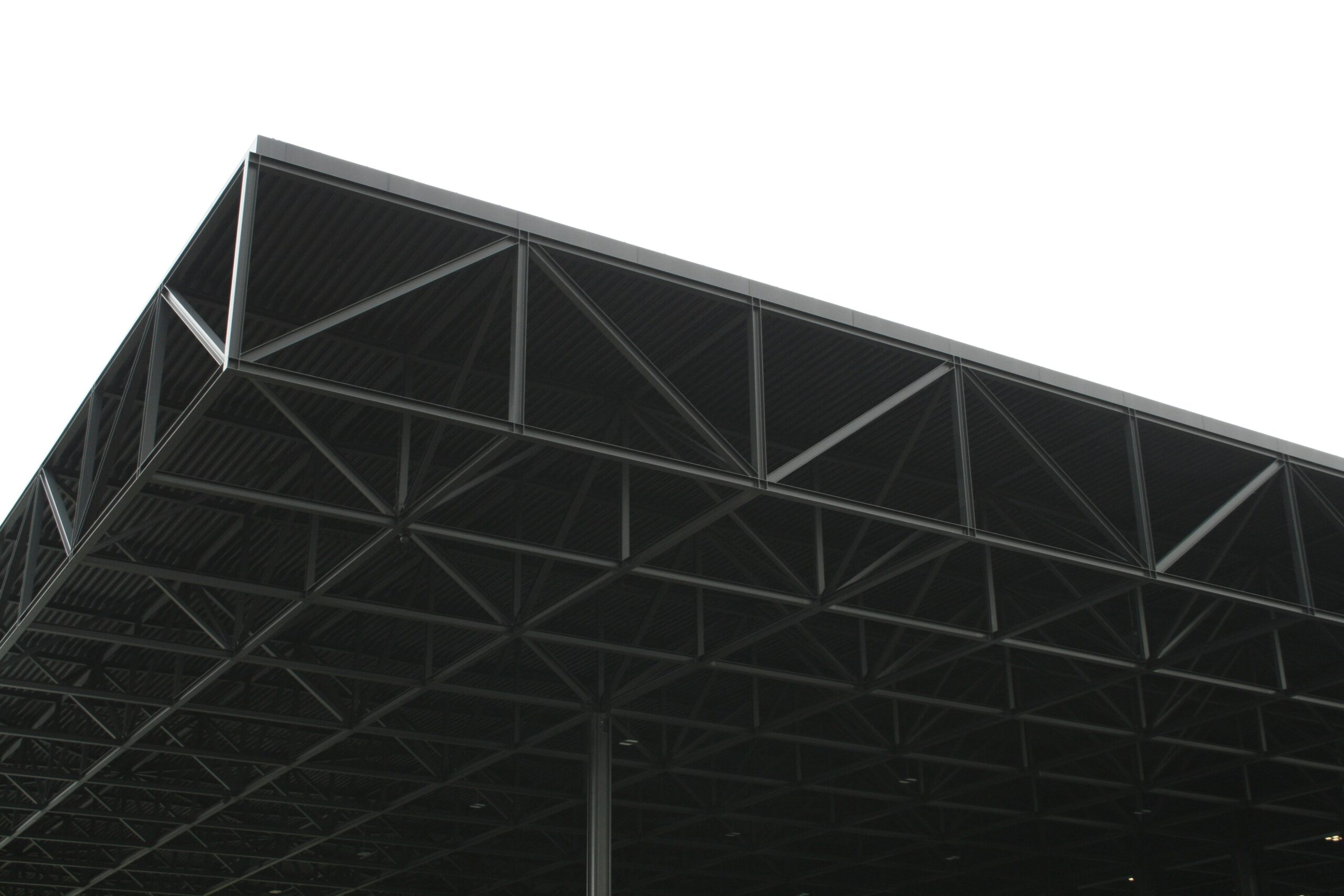 Hyper-realistic product photography of a cross-section of an RV composite panel, clearly showing the core material and outer skins, with a subtle background suggesting an RV manufacturing environment, emphasizing durability and modern construction, clean composition, no text, no brand logos.