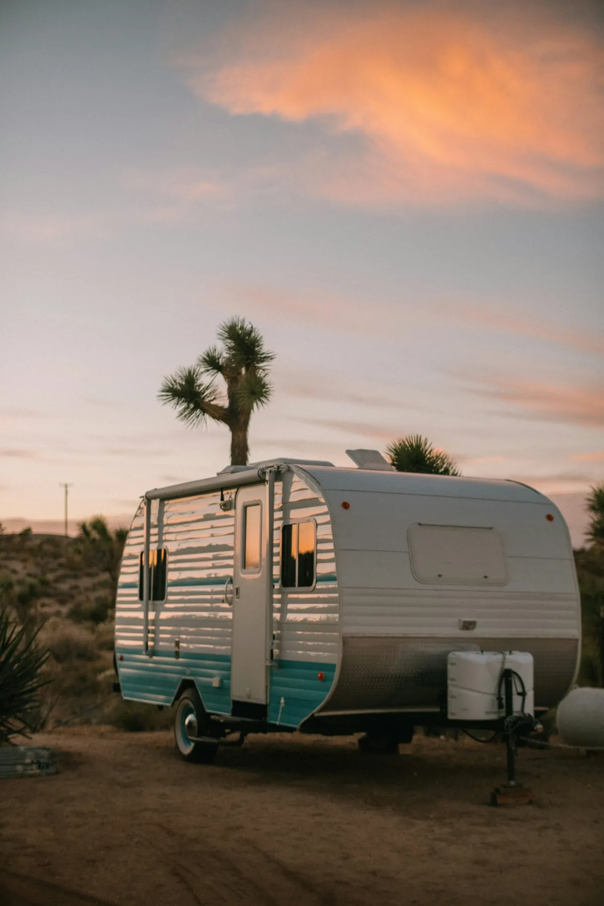 Hyper-realistic product photography of a custom aluminum sandwich panel, highlighting its lightweight yet rigid structure, with a subtle background of an RV silhouette, natural daylight, clean composition, no text, no brand logo.