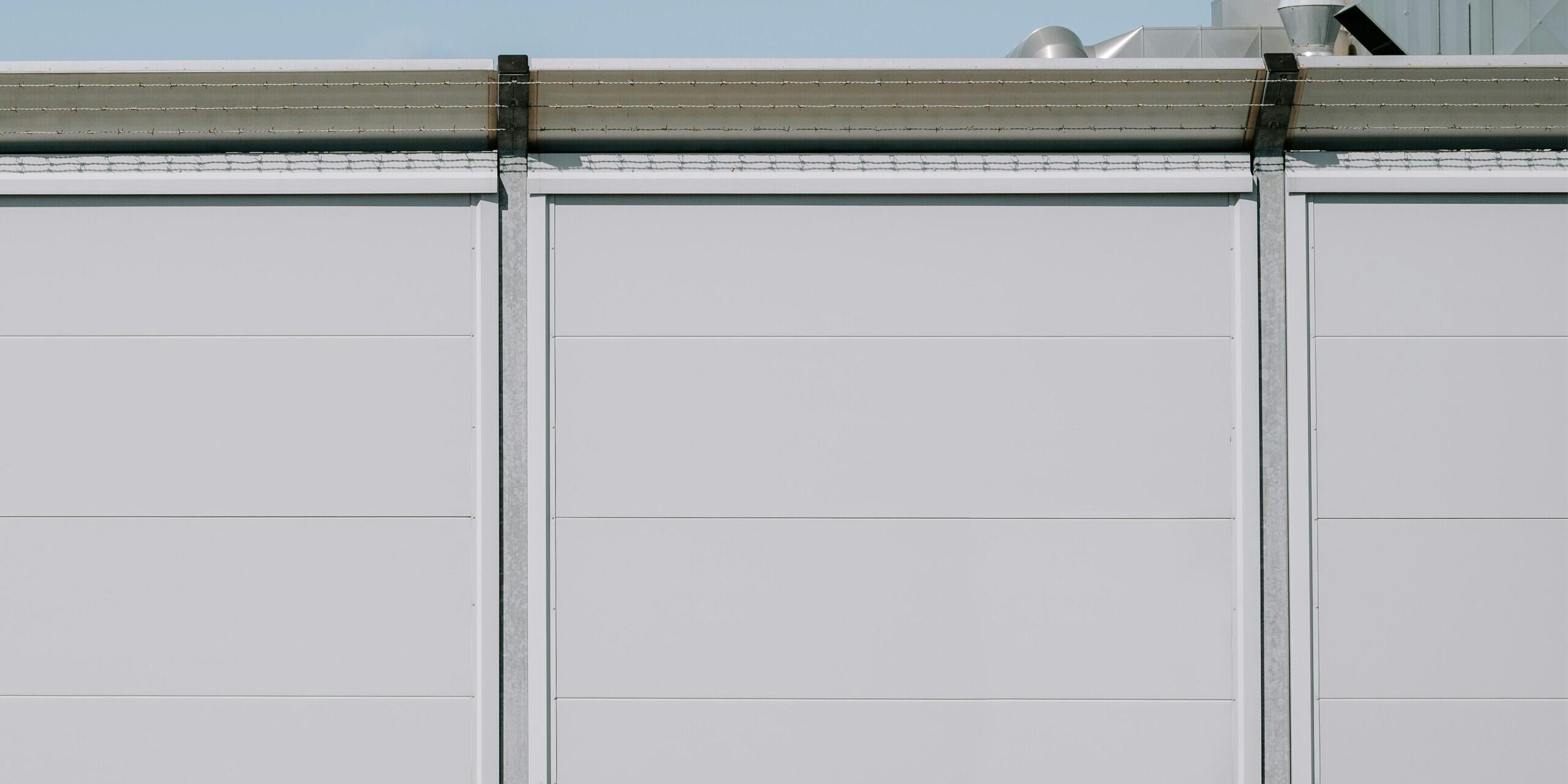 Hyper-realistic product photography of a custom CFRT panel integrated into an RV wall section, emphasizing its lightweight and structural integrity. The panel surface is smooth and modern, with a subtle texture of continuous fiber reinforcement visible. Bright, natural lighting, clean composition, no text, no brand logo.
