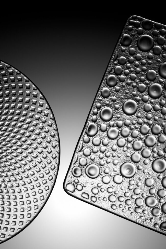 Hyperrealistic Product Photography Of A Pristine Cfrt Pu Pan Overview Hyper-realistic product photography of a pristine CFRT PU panel, showcasing its smooth surface and lightweight appearance, with a subtle reflection of a modern industrial setting. Bright, even studio lighting, clean composition, no text, no brand logo.