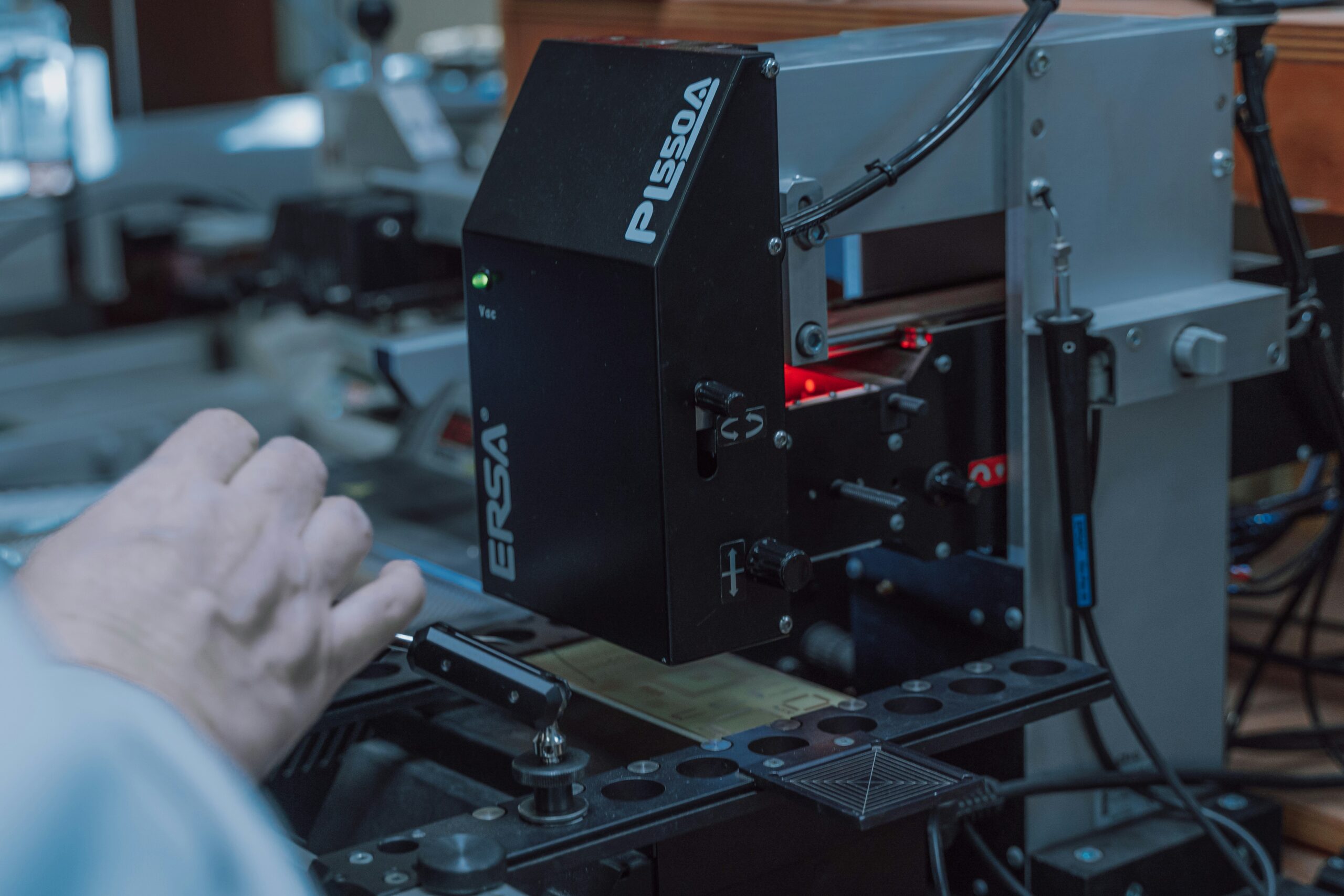 Hyper-realistic product photography of three distinct foam core samples: PMI, PET, and PVC, undergoing a shear strength test in a laboratory setting. A precision testing machine is applying force to the samples, with digital readouts visible. The scene is brightly lit, emphasizing the material properties. No text, no brand logos, clean composition.