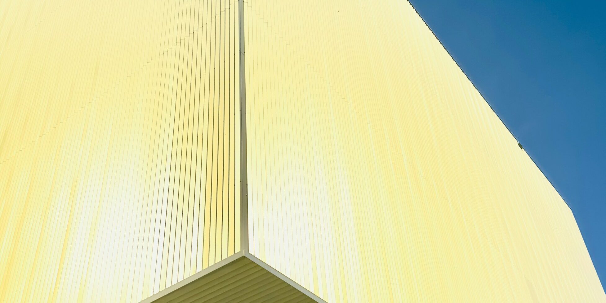 Hyper-realistic product photography of various fiberglass sandwich panels (CFRT, GRP/FRP honeycomb, foam core, aluminum) stacked neatly in a warehouse, showcasing different textures and thicknesses. Soft, diffused industrial lighting, clean composition, no text, no brand logos.