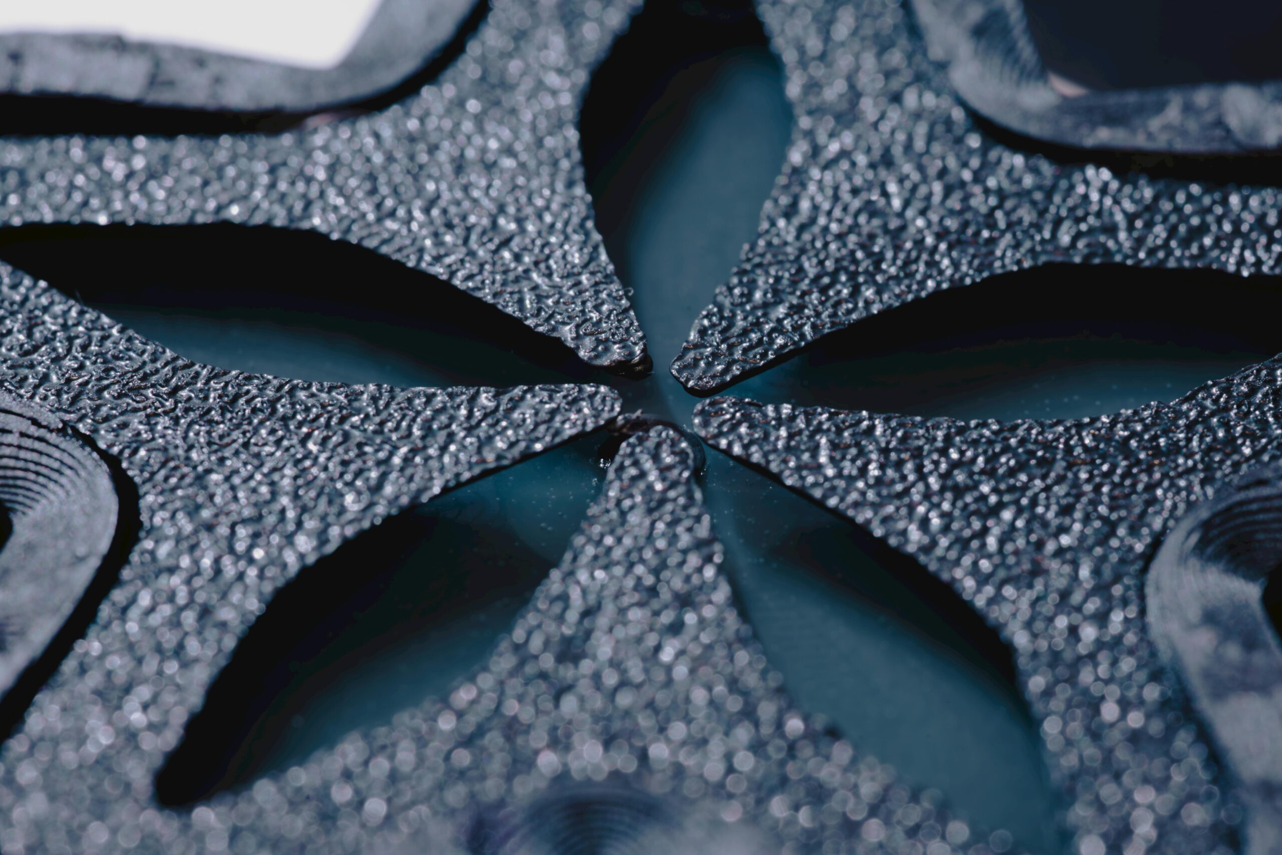 Hyperrealistic studio product photography of a clean-cut cross-section of an FRP foam core sandwich panel. The image clearly shows the two outer white fiberglass reinforced plastic (FRP) skins and the thick, light-blue XPS foam core in the middle. The panel is resting on a polished concrete surface. Soft, diffused studio lighting highlights the distinct layers and textures. Macro detail, clean composition, no text, no brand logo.